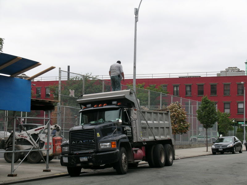 fat man on a dump truck